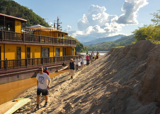 guest excitingly on board Anouvong cruise