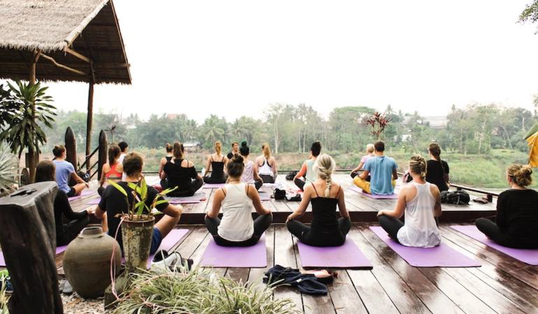 Practicing yoga on Laos river cruises